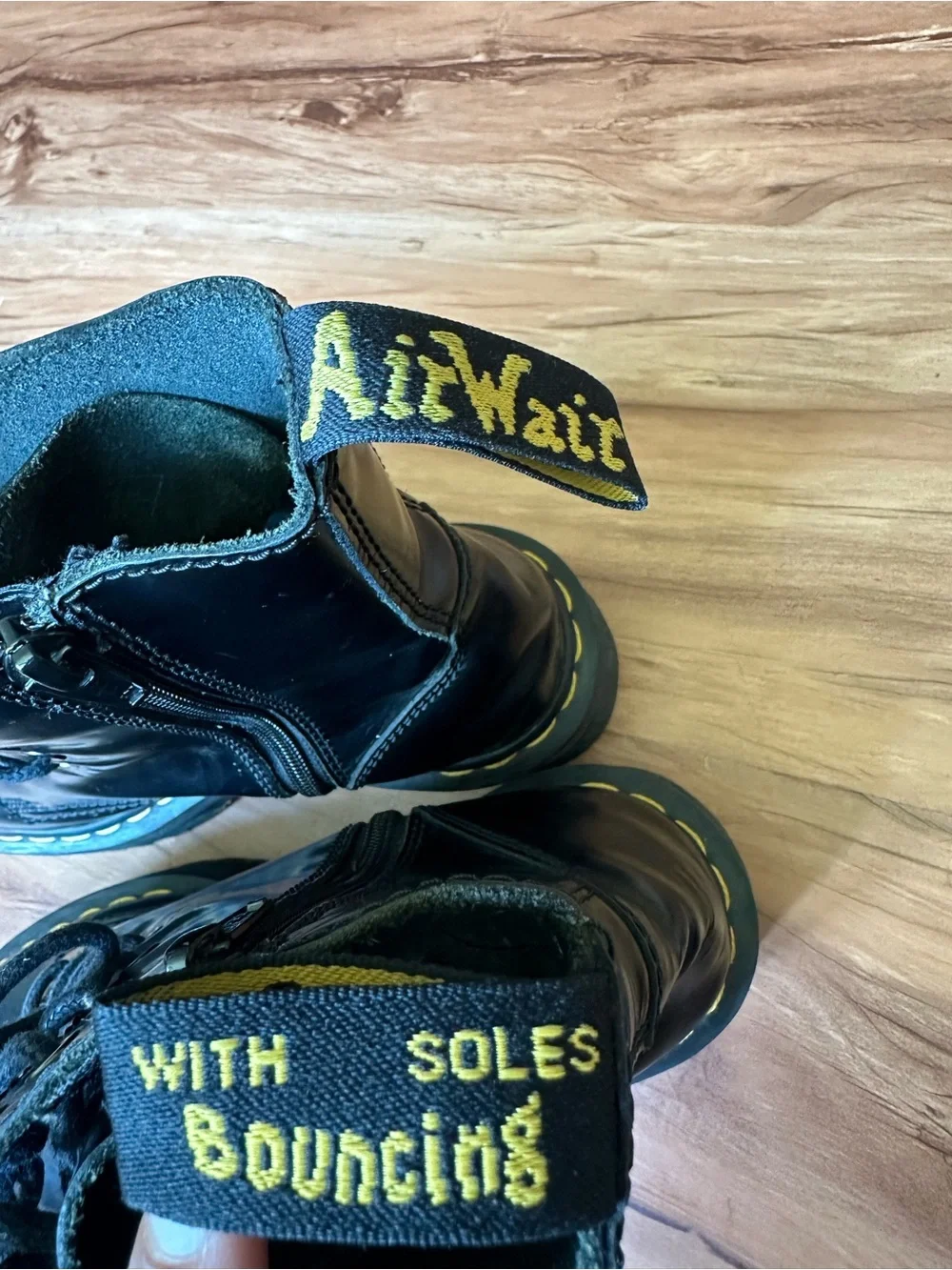 Dr. Martens Black Leather Platform Combat Boots with Yellow Stitching